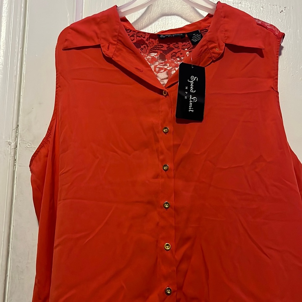 A Coral Button Down Blouse.